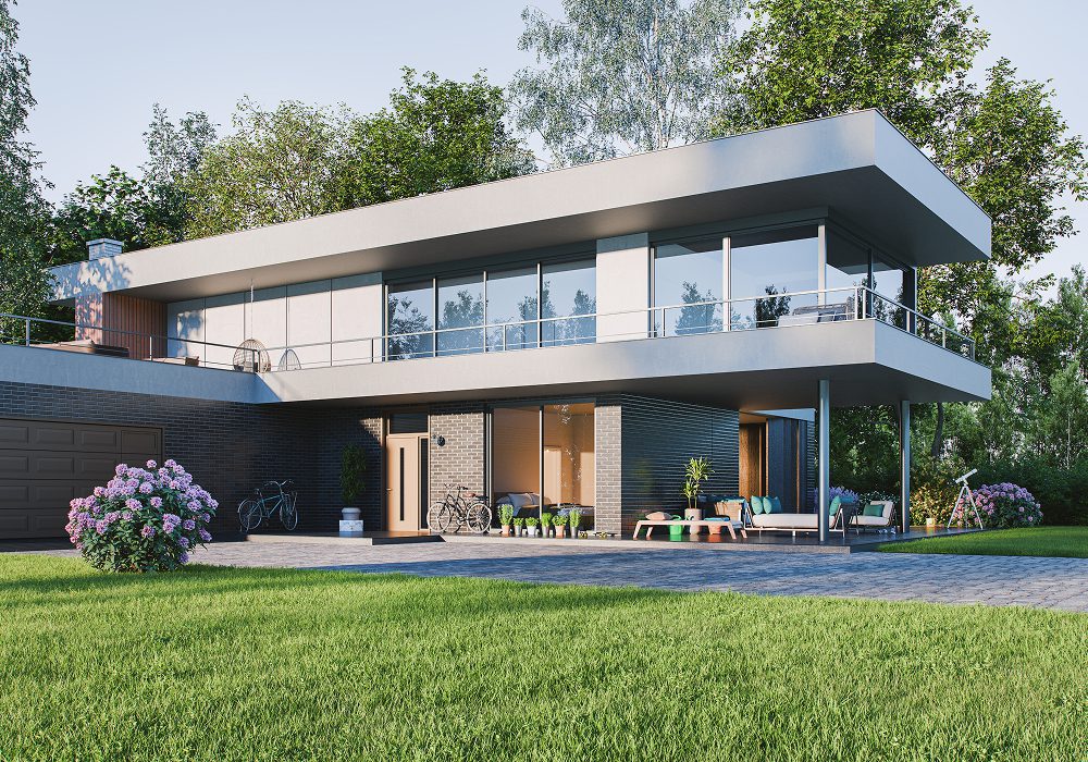 Modern house with a large lawn in front of it, surrounded by trees and plants with flowers