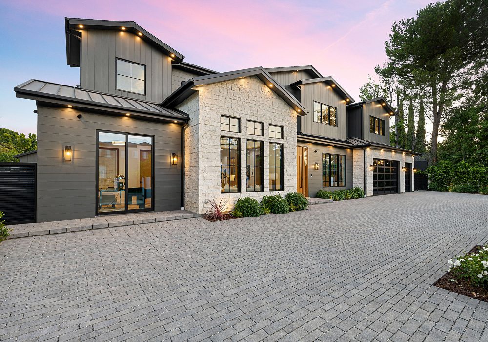 Contemporary home with stone and dark siding